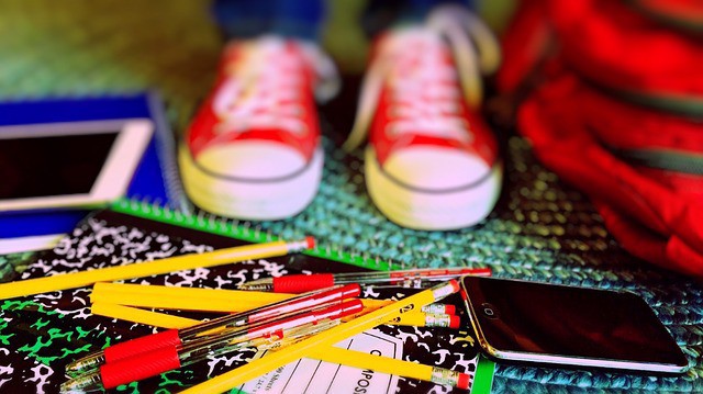 Image of student standing among supplies Image of student standing among supplies